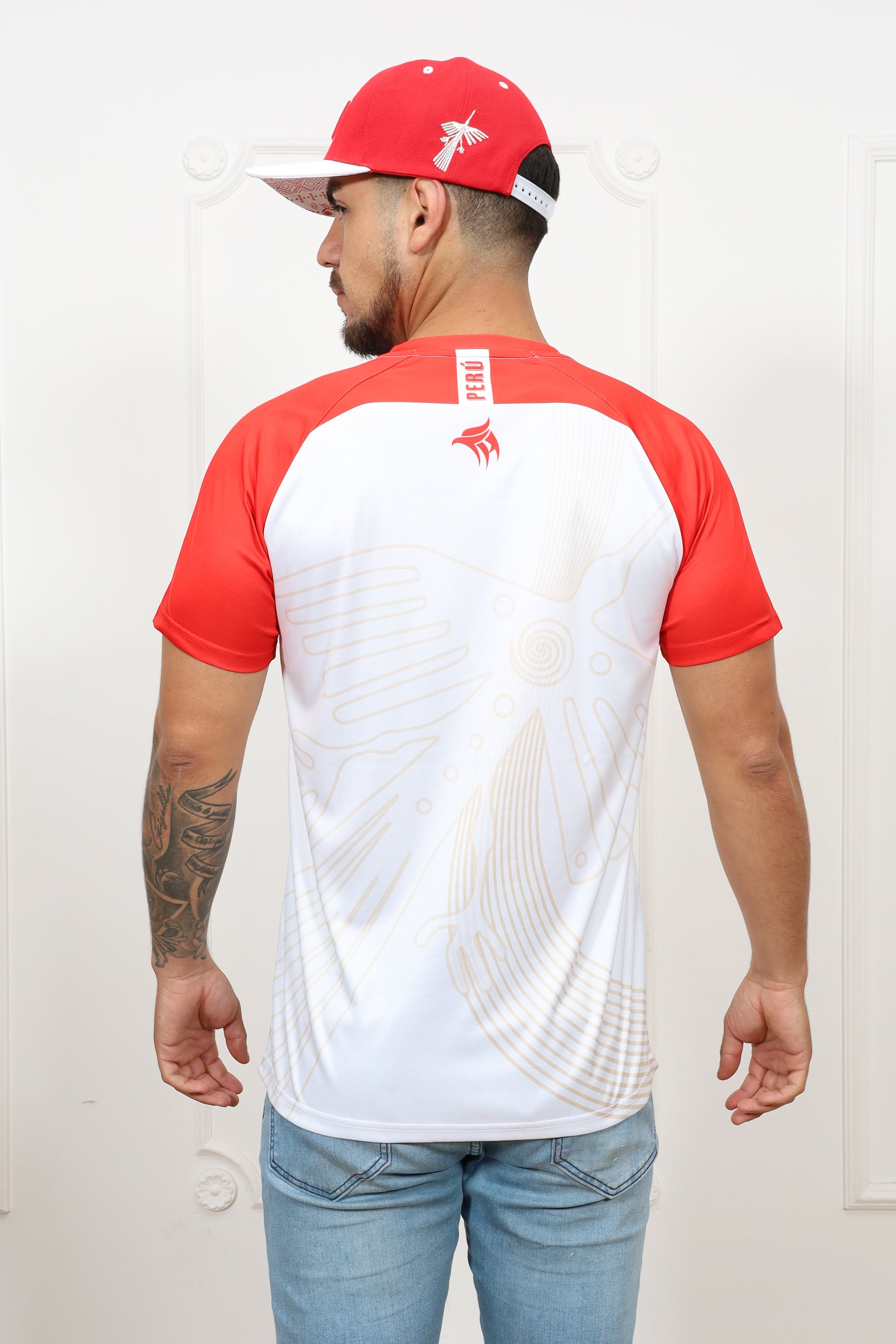 Person wearing a red and white sports outfit with a cap on a white background