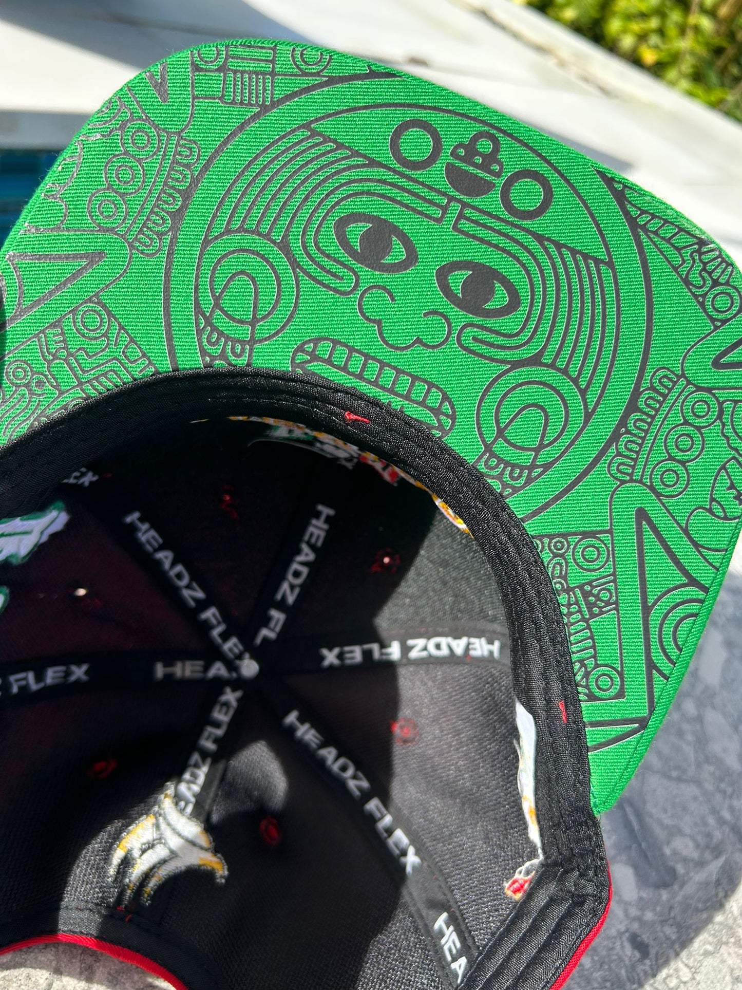 Close-up of Maya symbol design under brim