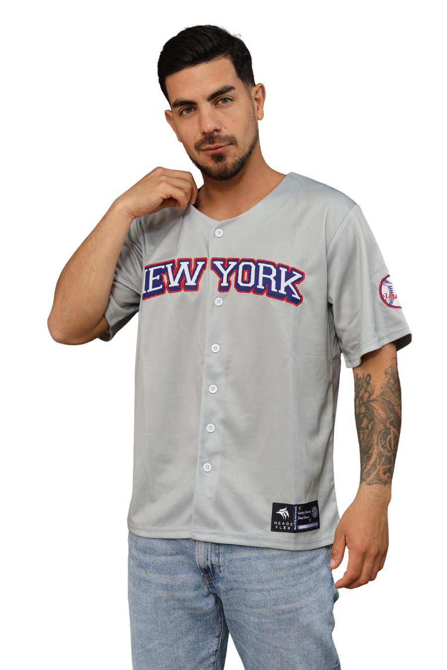 Man wearing a gray 'New York' baseball jersey on a white background