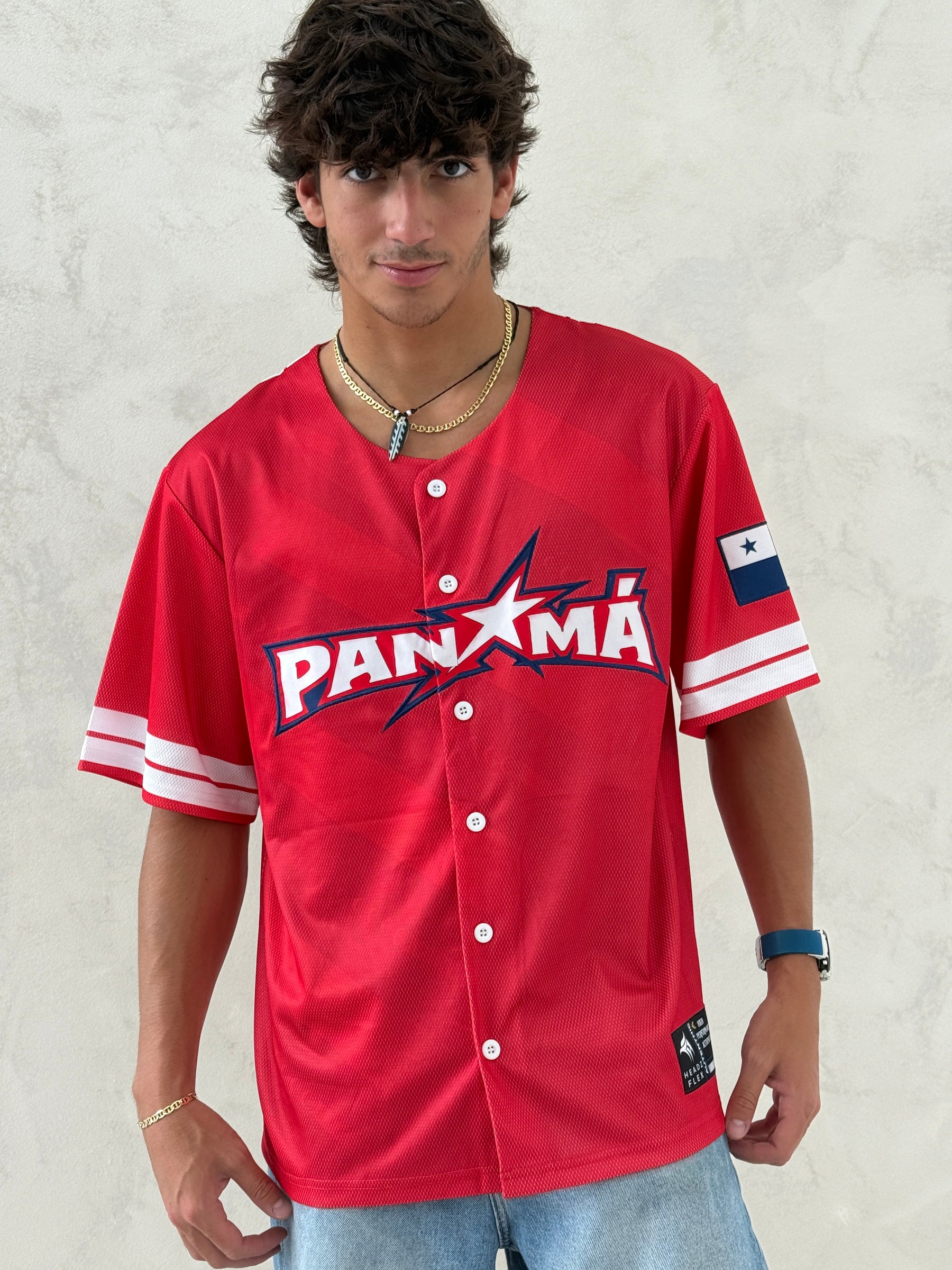 Person wearing a red 'PANXMA' jersey on a light background