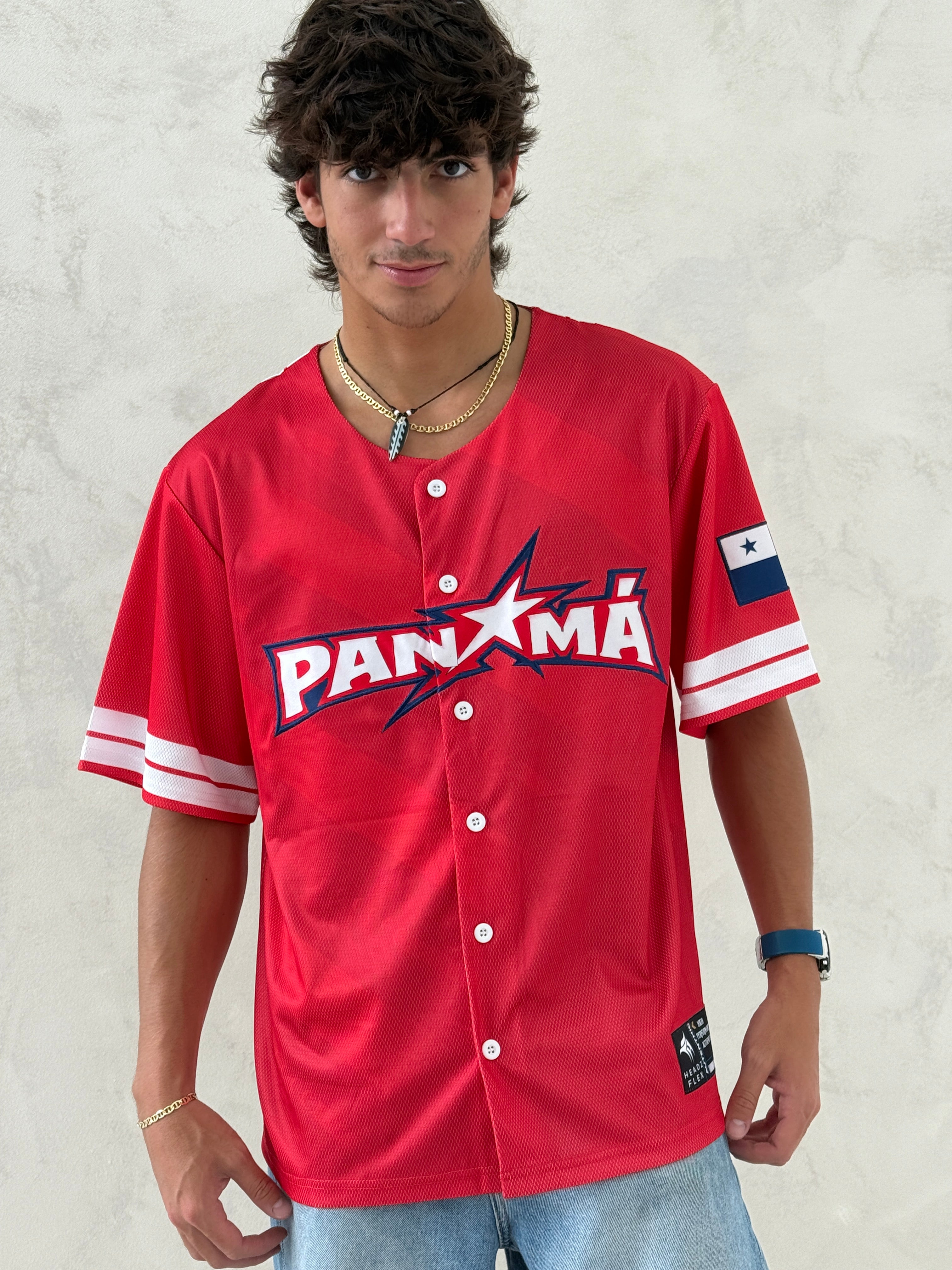 Person wearing a red 'PANXMA' jersey on a light background