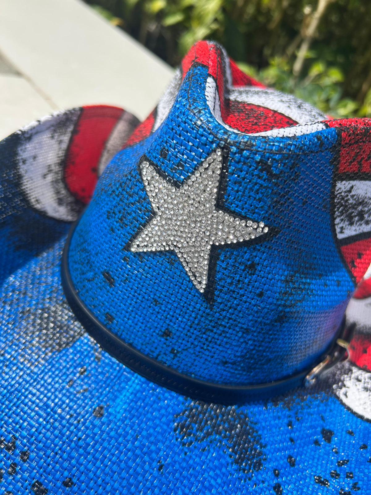 Blue sequin shoe with a star design on a matching fabric background