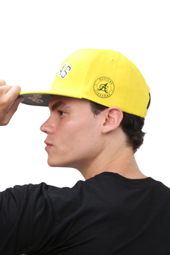 Side view showing Dominican flag patch on Águilas Cibaeñas cap

