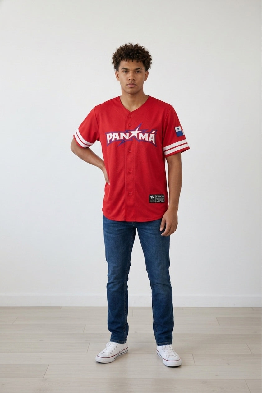 Person wearing a red Panama baseball jersey with blue jeans and white sneakers on a plain background