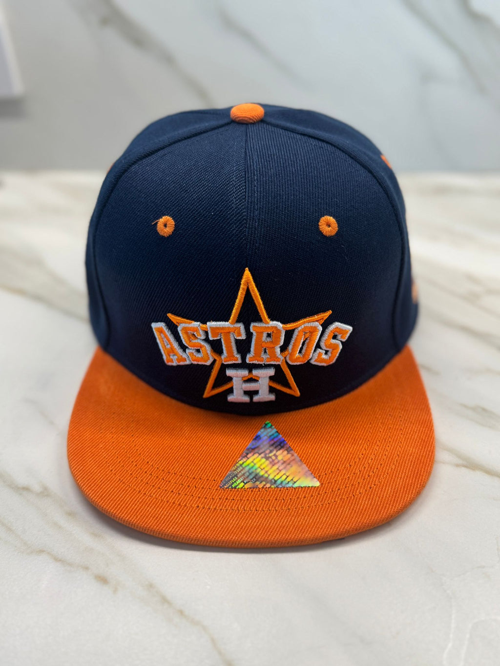 Front view of Houston team baseball cap in orange and navy

