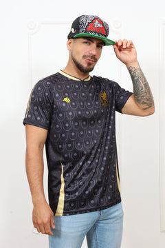 Person wearing a patterned shirt and jeans, holding a cap on a white background