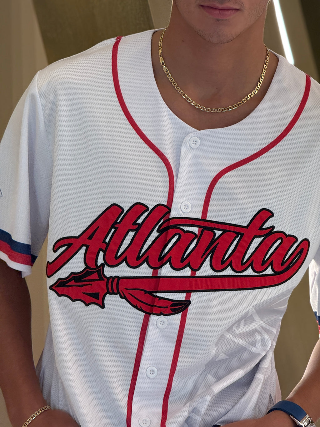 Atlanta baseball jersey 13 - White baseball jersey with red 'Atlanta' text and logo on a neutral background