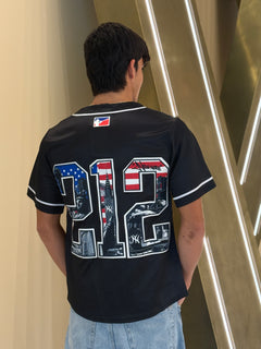 Person wearing a black sports jersey with a large number '712' and American flag design.