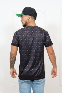Person wearing a patterned shirt and jeans on a white background