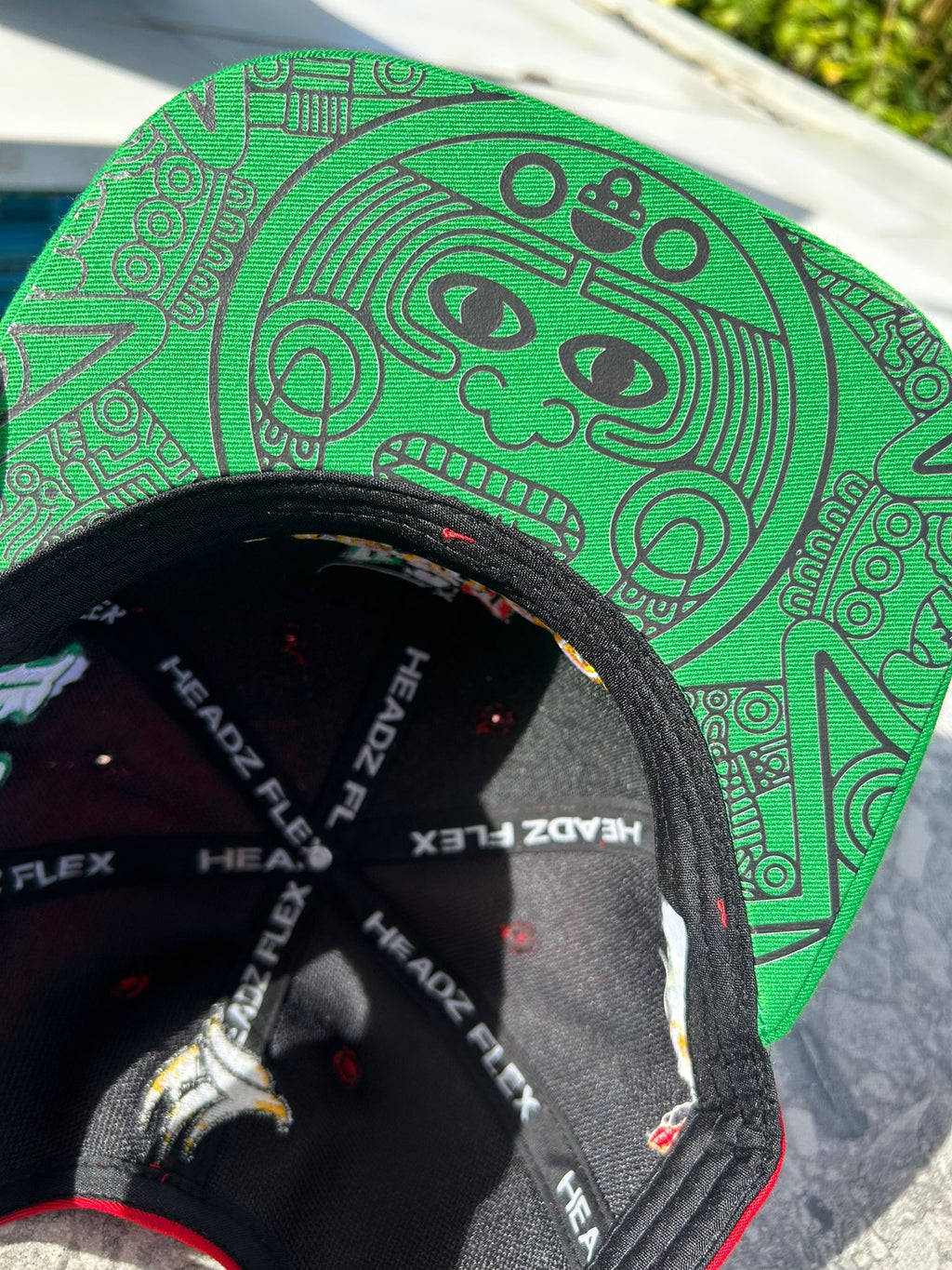 Close-up of Maya symbol design under brim

