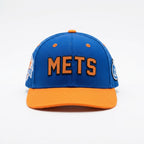 Blue and orange Mets cap on a white background
