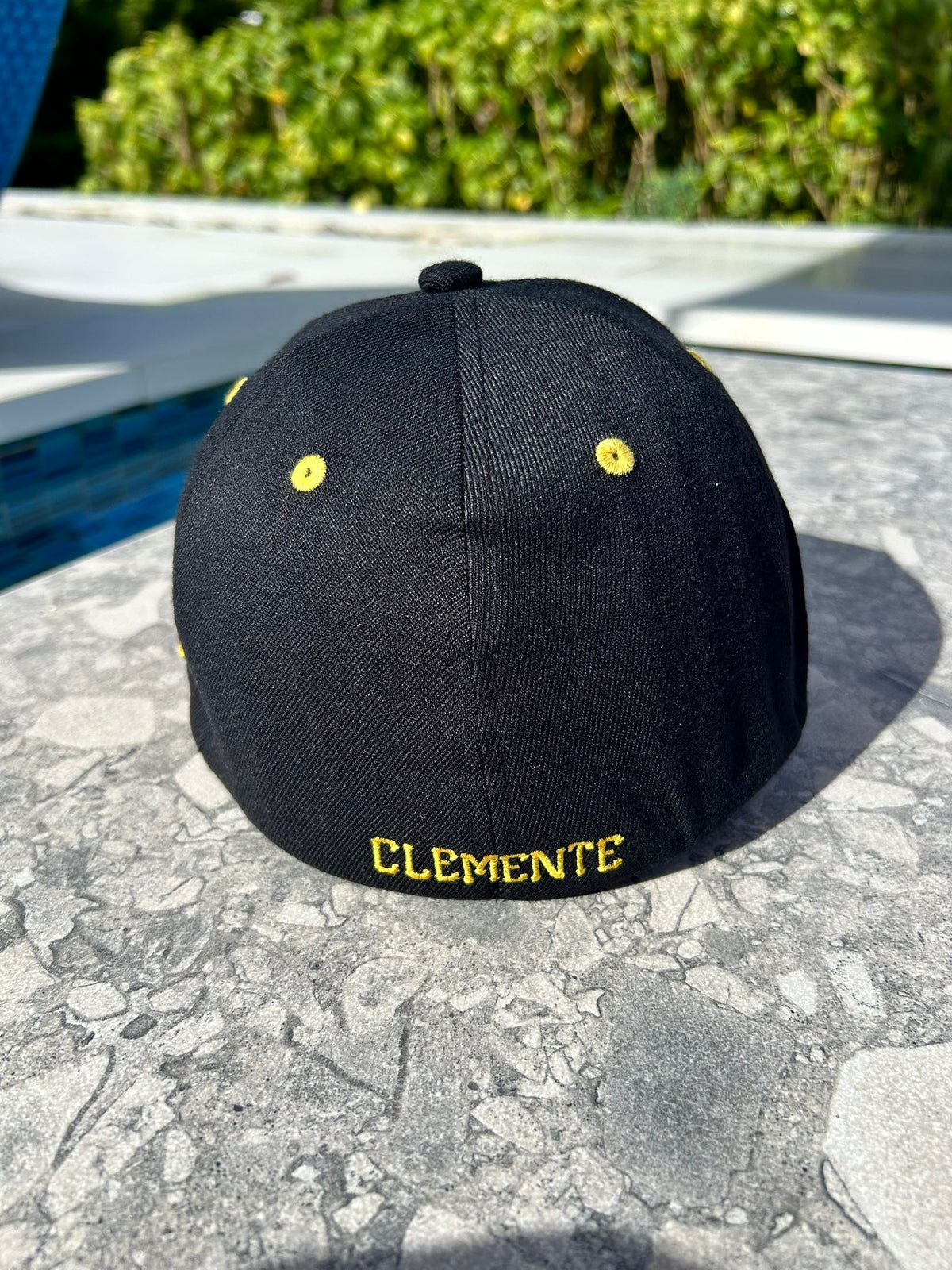 Back embroidery detail on Caribe Heritage Black and Yellow Cap

