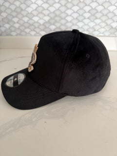 Black velvet snapback hat curved brim side view
