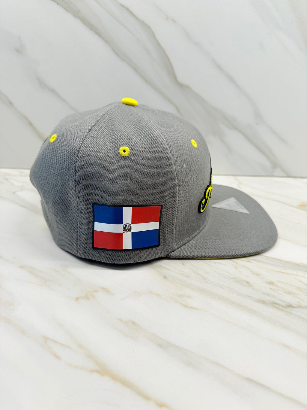 Dominican Republic flag patch on side of Águilas Cibaeñas baseball cap

