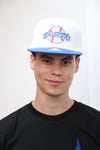 A person wearing a blue and white Los Angeles Dodgers fan cap with 5D embroidery and a structured crown.