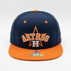 Navy and orange Houston Astros cap on a white background