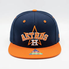 Navy and orange Houston Astros cap on a white background