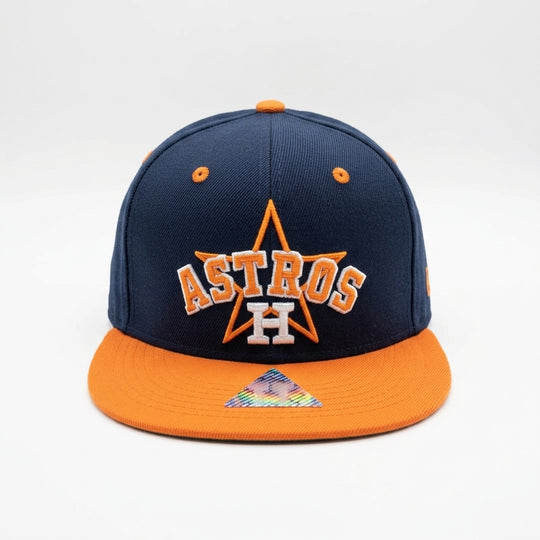 Navy and orange Houston Astros cap on a white background
