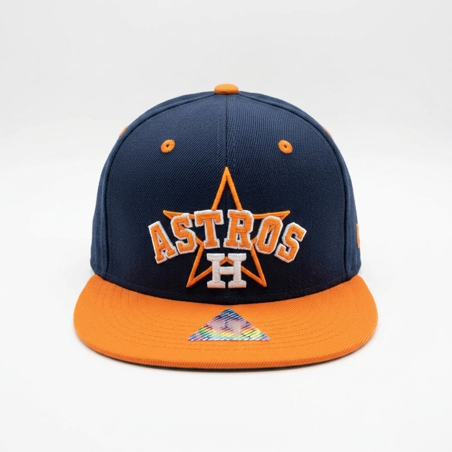 Navy and orange Houston Astros cap on a white background