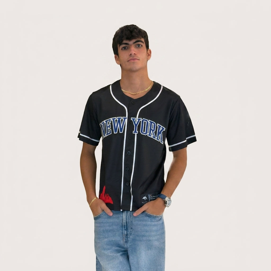 Person wearing a black 'New York' baseball jersey on a plain background