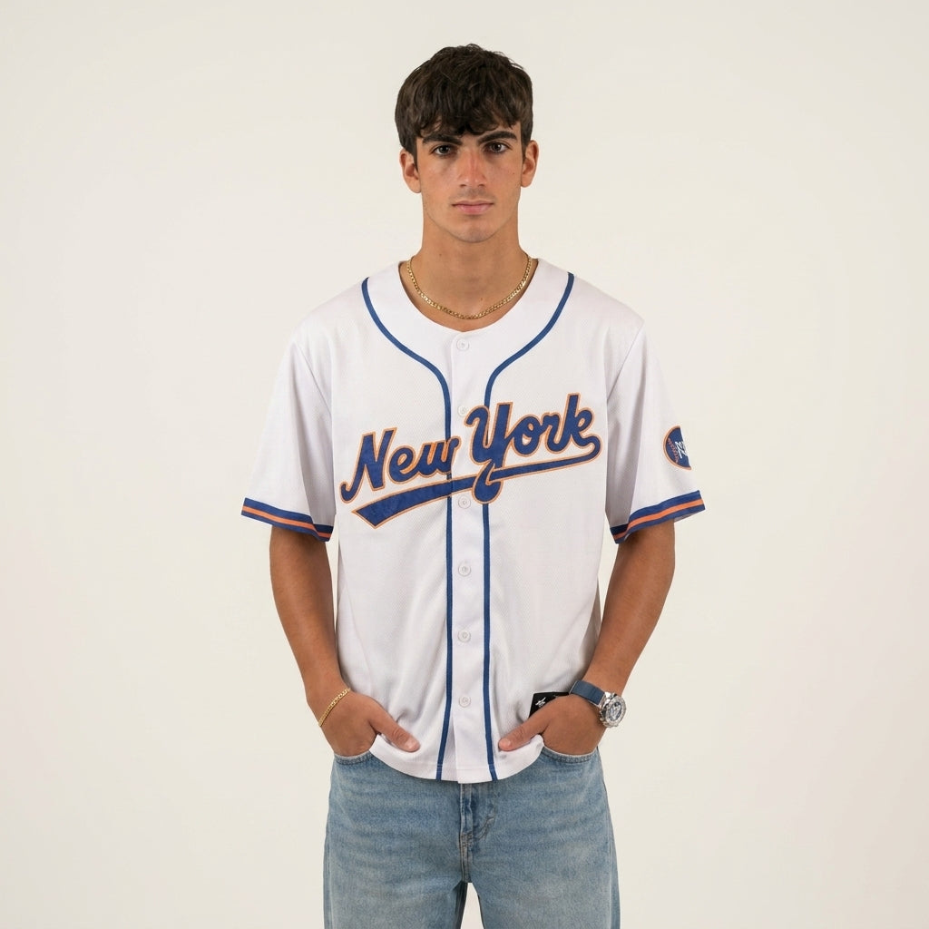 Person wearing a New York baseball jersey on a plain background