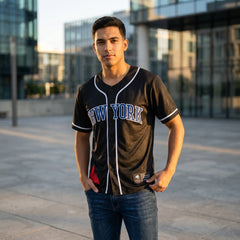 Man wearing a New York baseball jersey standing in an urban setting