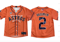 An orange baseball jersey with 'ASTROS' embroidered on the front and the name 'BREGMAN' along with the number '2' on the back. The jersey features a button-up design and a star logo.